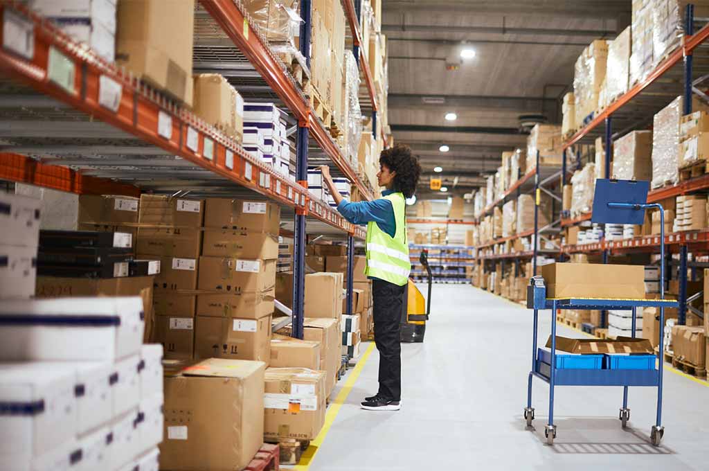 Woman organizing orders in the warehouse.