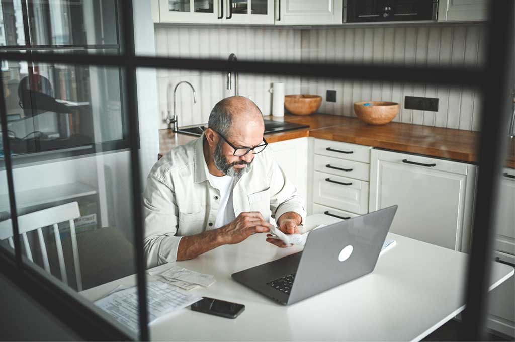 Man preparing his taxes.